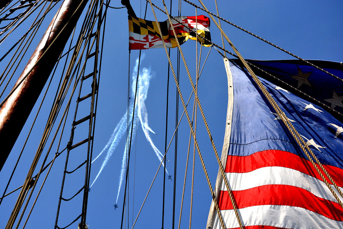 Jets splitting up with flags in the foreground