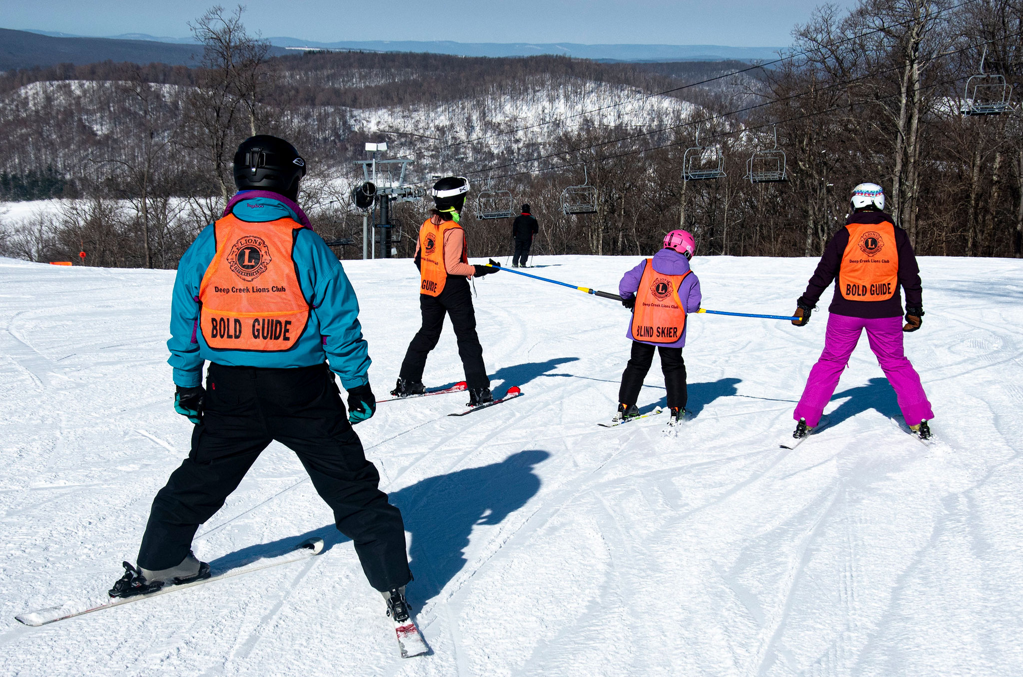 Blind skiier with guide
