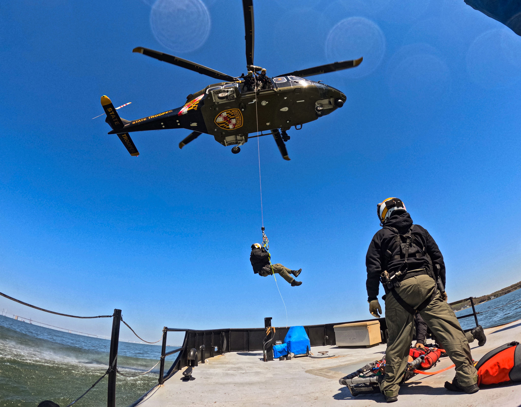 Helicopter hovering over the deck picking up a Trooper